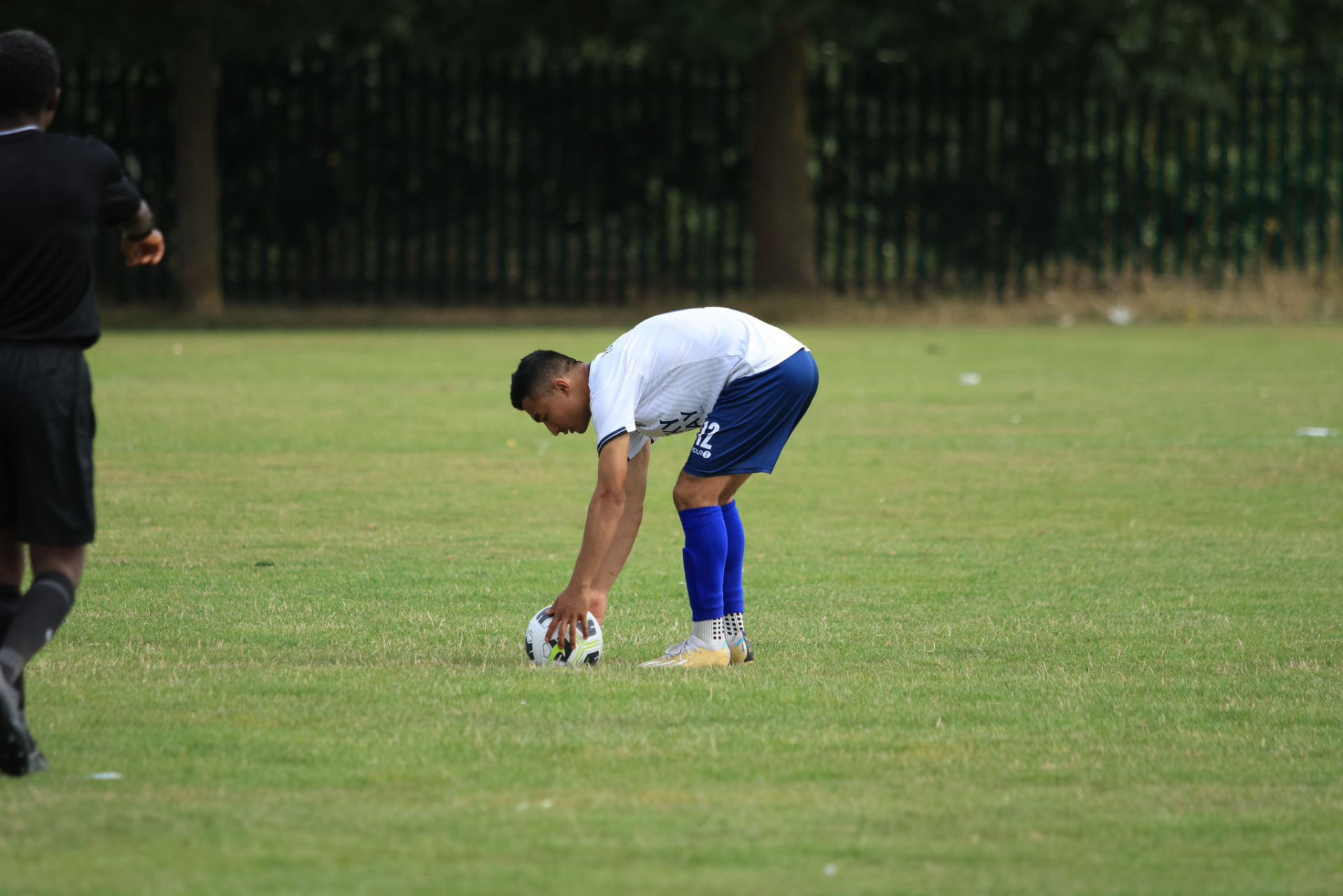 Sajan Dangol setting a ball down for a free kick