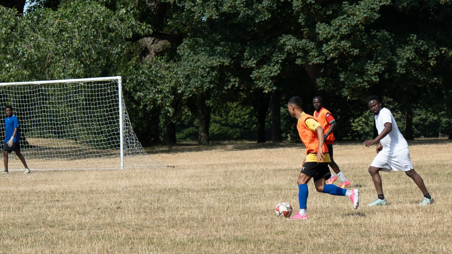 Sajan Dangol taking on a defender during a Sunday league match